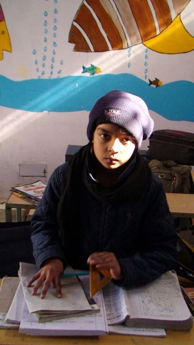 A student at her desk in a village government school